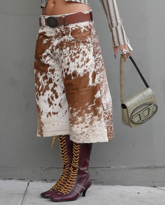 Shop authentic cow print shorts for women. Brown and white hair-on-hide design, ideal for rodeo and gifting.