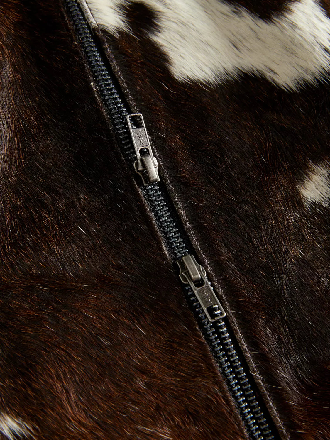 Real hair-on-hide women cowhide mini skirt in a one-of-a-kind tricolor pattern. Pair this cow print skirt with boots or jackets for an eye-catching western or urban look.