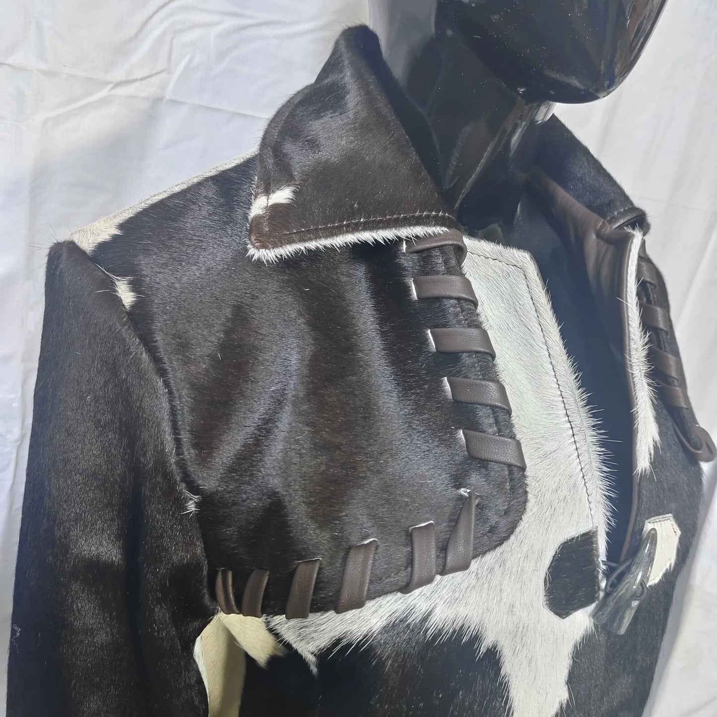 Add edge to your cold-weather wardrobe with a unique cow fur long coat—real leather, real cowhide, and 100% statement-making fashion.