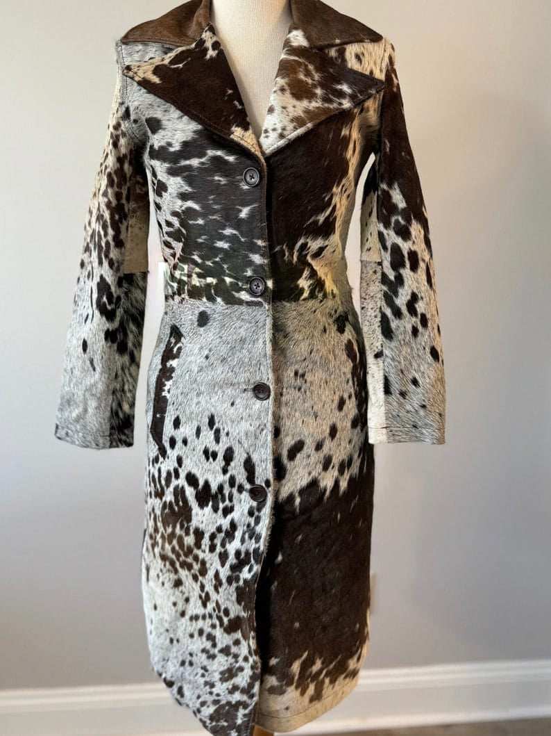 Genuine cowhide fur women’s trench coat with distinctive hair-on hide. Designed for southern events, concerts, and country lifestyle.