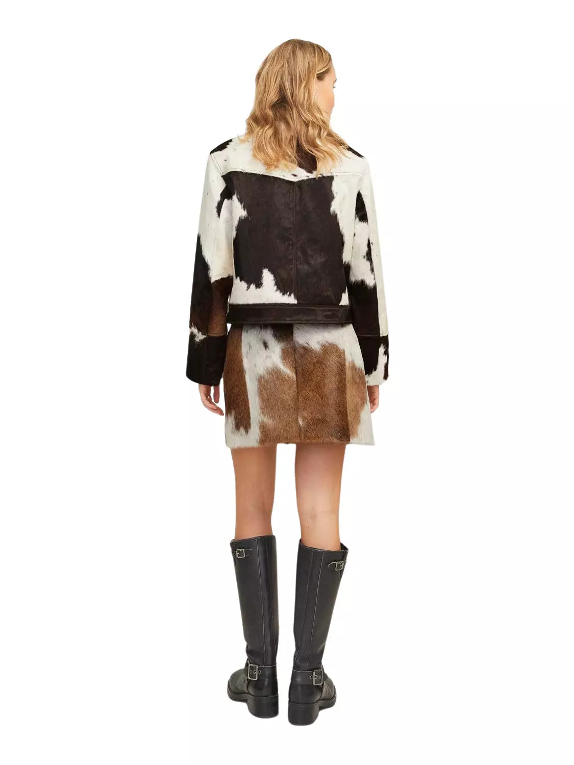 Women’s cowhide skirt and jacket combo designed for southern events, western styling, and ranch wear. Made from authentic cow skin panels.