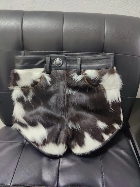 Stand out with real cowhide mini shorts in bold black and white cow print. These women cow skin shorts bring raw Western energy to any streetwear look.