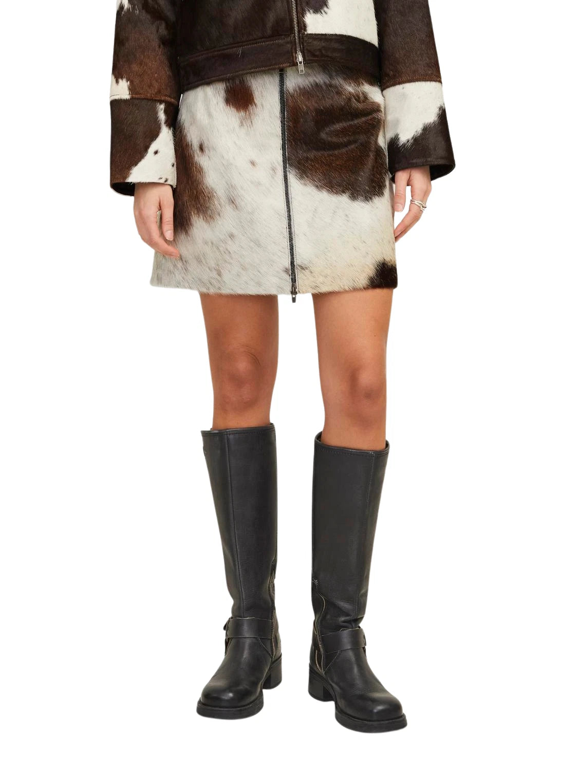 Western cowhide outfit for women with real hair-on-hide cow jacket and skirt. Ideal for country weddings, rodeos, and cowgirl festival looks.