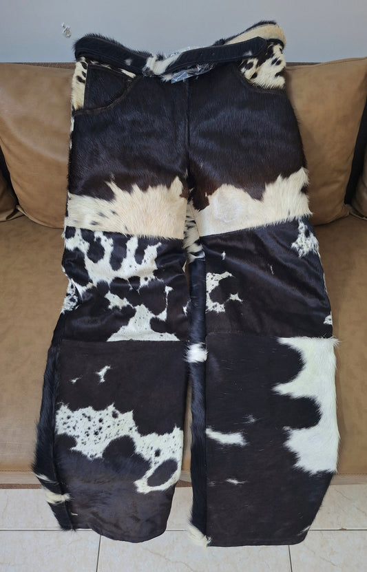 Genuine cowhide trousers with black and white hair-on-hide finish, perfect for western wear, rodeo nights, and bold country statement outfits.