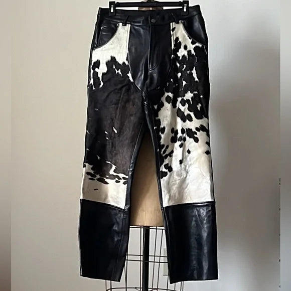 Cowhide fur and leather combine in these trousers for a textured look that stands out. A unique mix of materials adds character, making them a bold addition to any wardrobe.