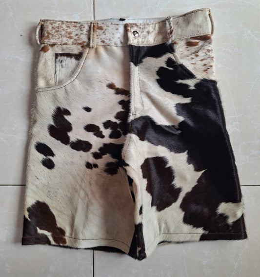 Black white cowhide shorts made from genuine cowhide. Each pair features a unique pattern ideal for fashion-forward western and urban looks.