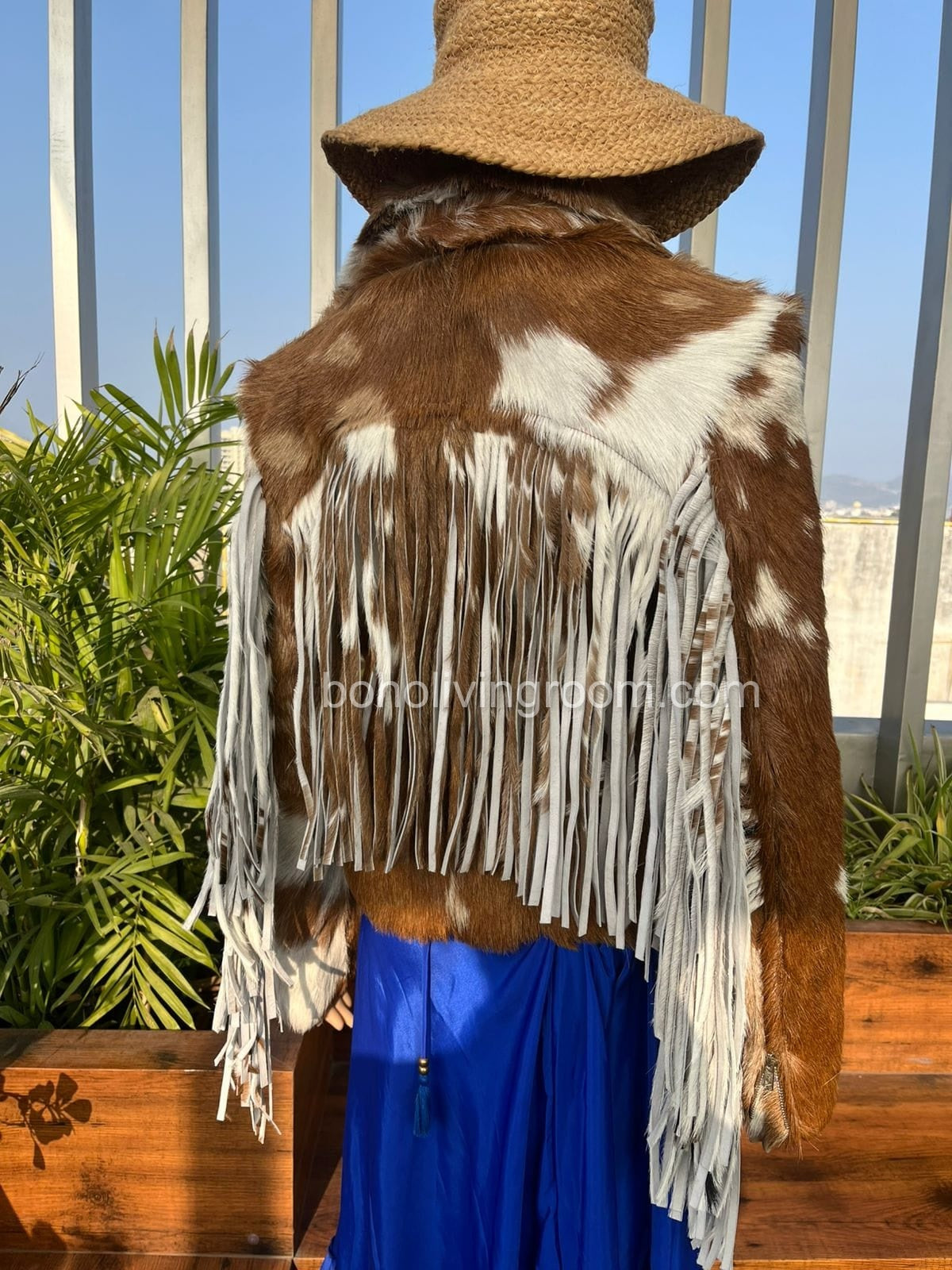 Find your new favorite cowhide fur coat with natural hair-on-hide texture and bold fringe details. A must-have cow print jacket for women who love Western fashion.