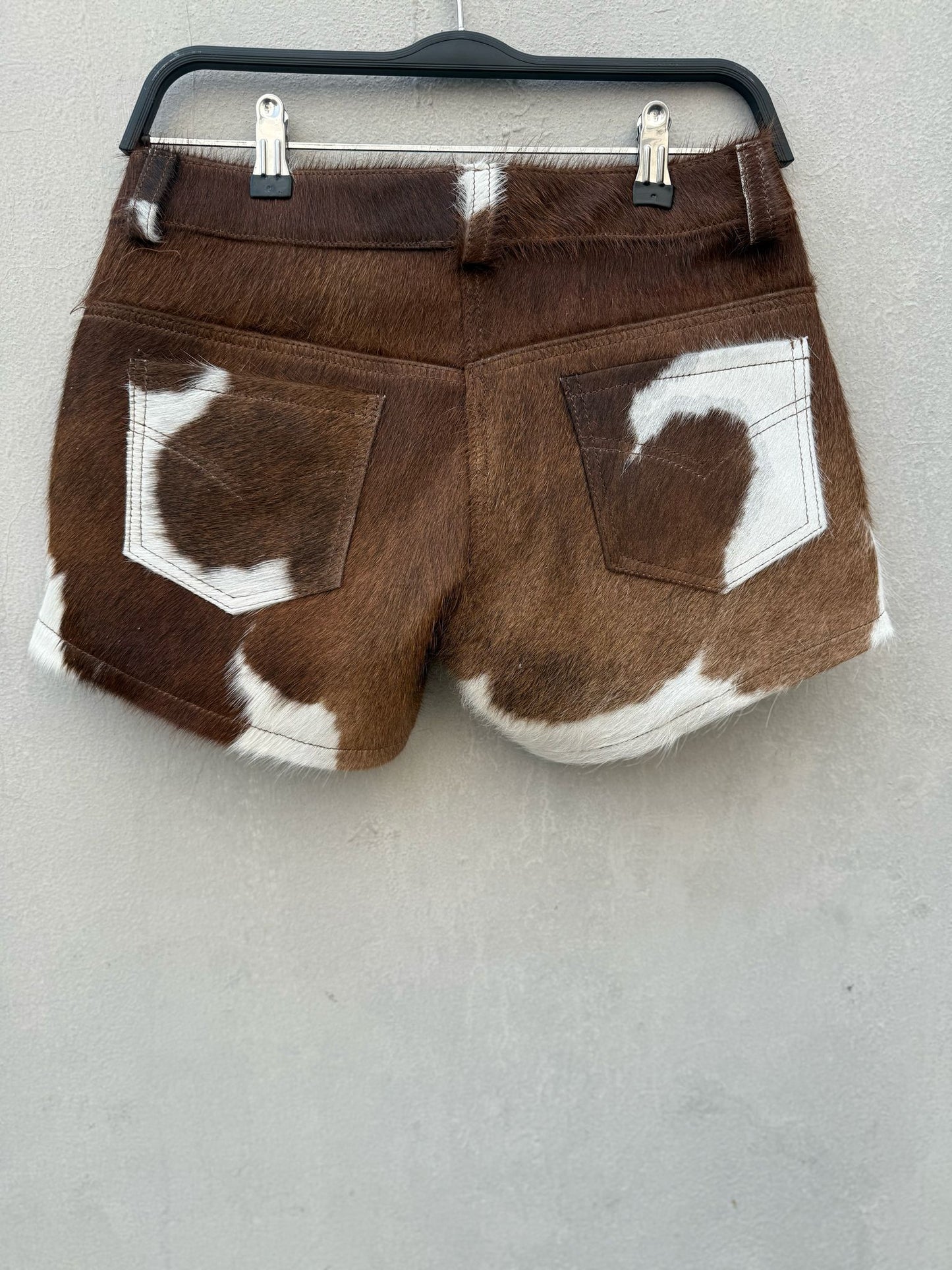 Handmade women cowhide shorts with unique cow print design. Ideal for rodeo, ranch life, and country music festivals. Premium western styling.