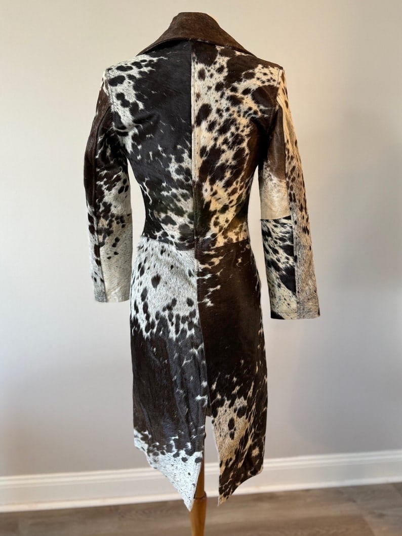 Authentic hair cowhide trench coat for women with natural spotted fur pattern. Perfect for rodeo, country, and southern fashion.