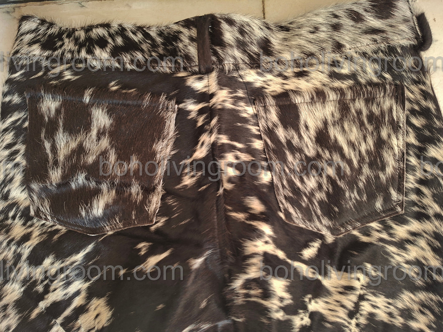 Tricolor cowhide shorts with authentic cow fur texture. Women’s western shorts ideal for country concerts, festivals, and ranch styling.