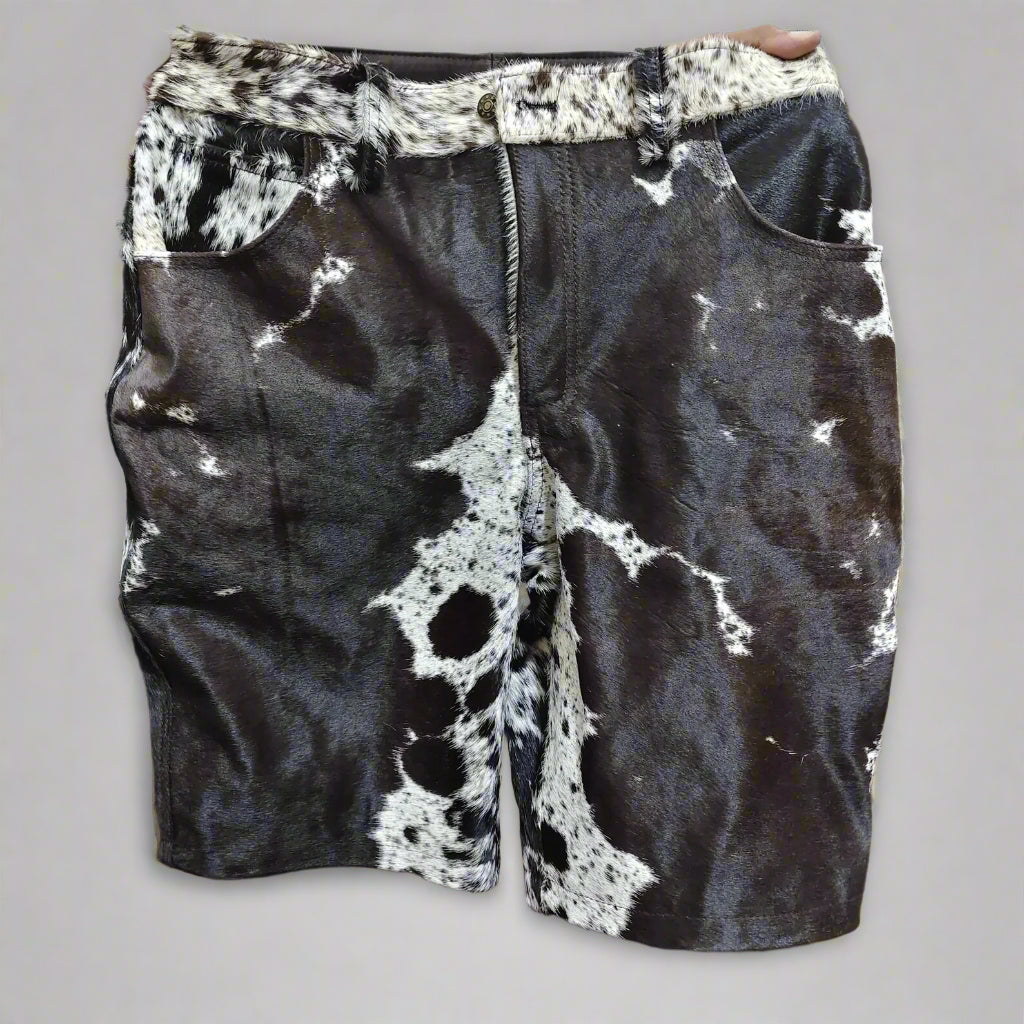 Men’s cowhide shorts made from real hair-on-hide. Black and white cow fur shorts for rodeo, western outfits, and country fashion.