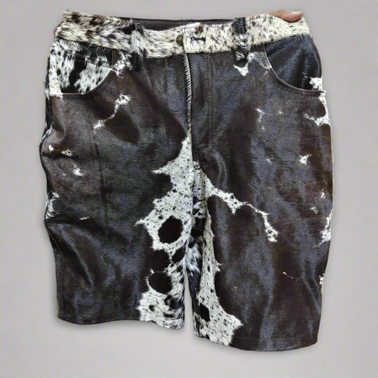 Men’s cowhide shorts made from real hair-on-hide. Black and white cow fur shorts for rodeo, western outfits, and country fashion.