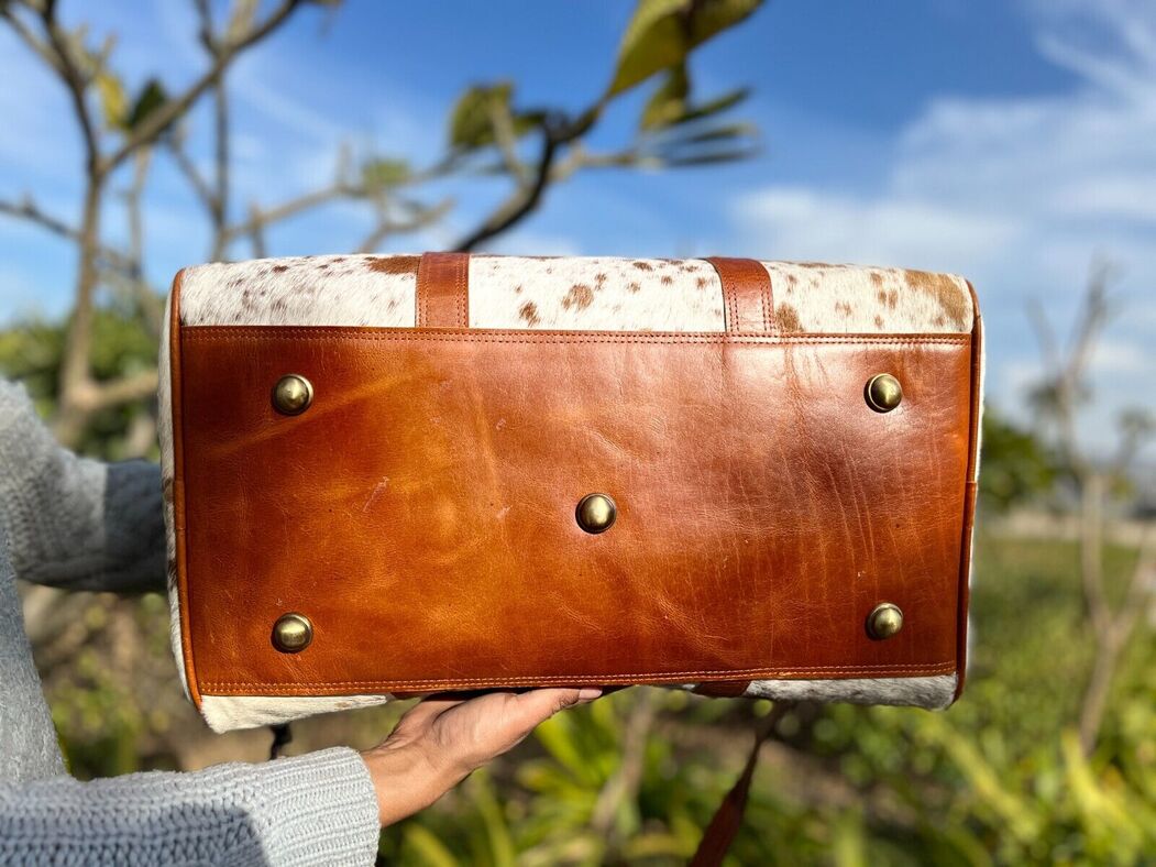 Hit the road in comfort and style with a chic cow fur weekender bag, designed for the modern traveler.