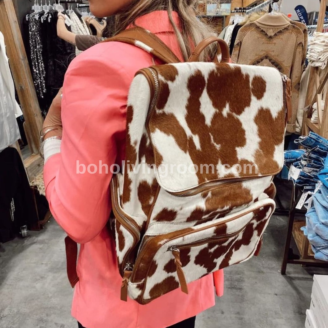 Elegant cow skin backpack featuring high-quality craftsmanship, designed to complement any outfit with its understated luxury.