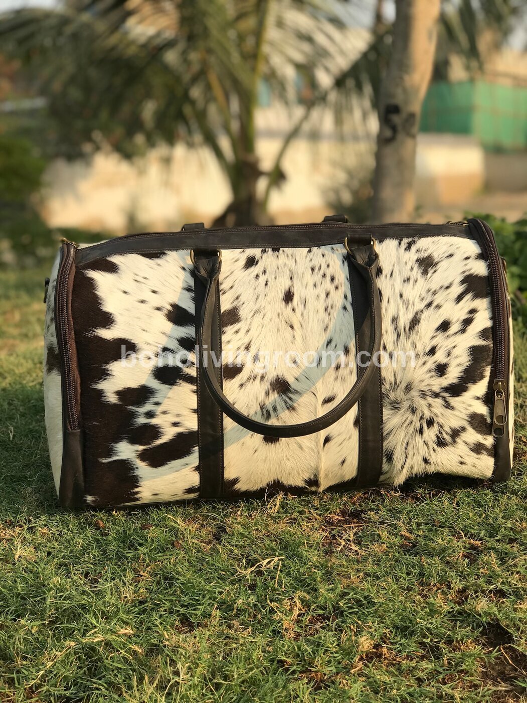 Stay organized on the go with our spacious cowhide duffle bag. Designed for durability and style, it's a travel essential.