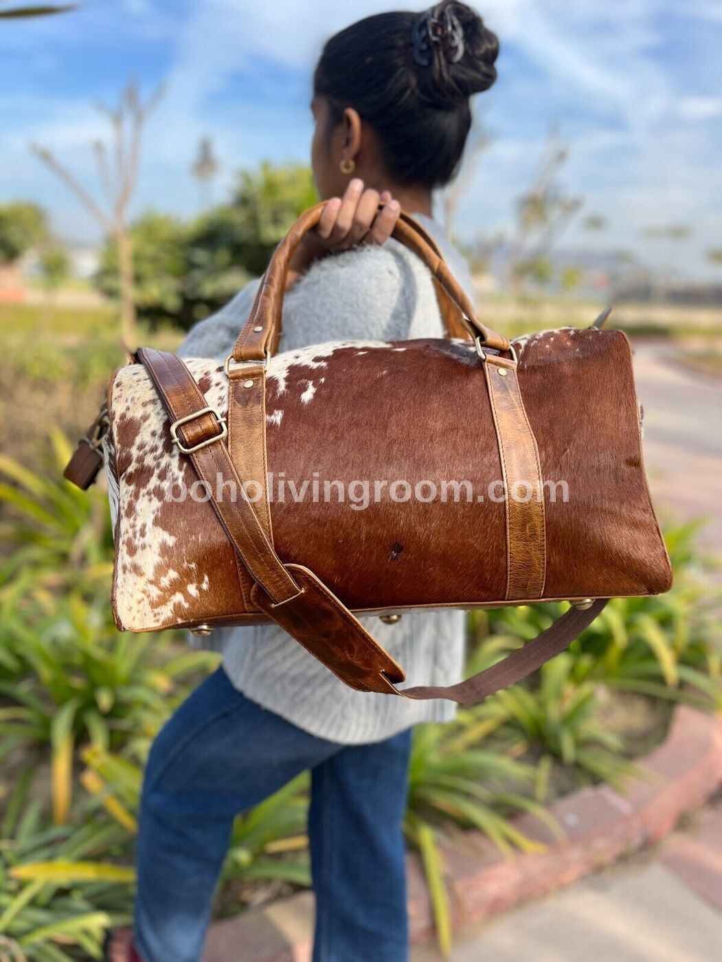 Upgrade your travel gear with a cowhide duffle bag. Rugged yet refined.