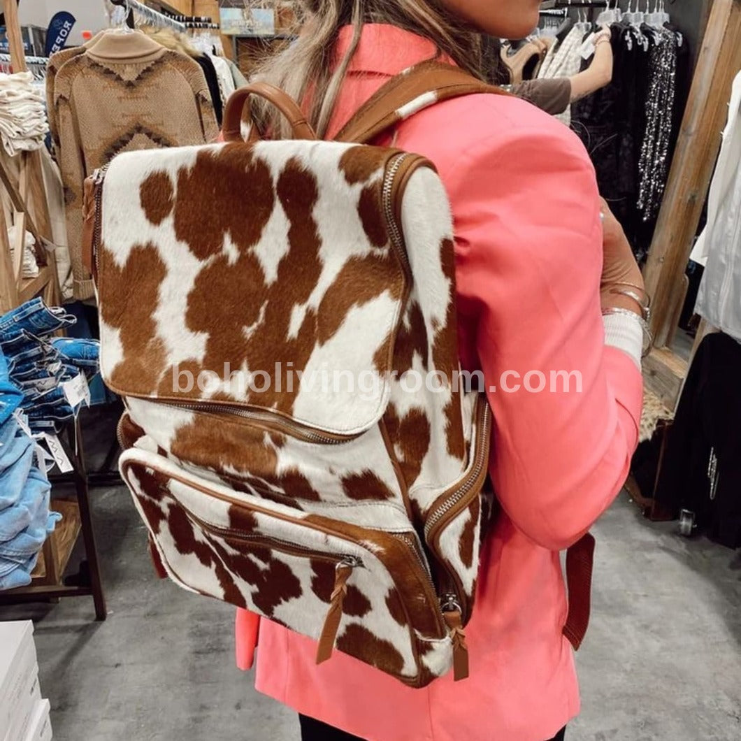 Durable cowhide backpack crafted for comfort and functionality, featuring padded straps and quality materials for lasting wear.
