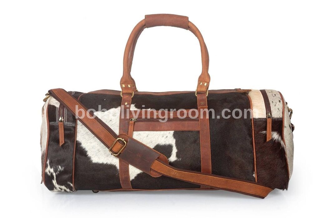 Make a statement with a timeless cow fur weekender bag, your essential companion for spontaneous getaways.