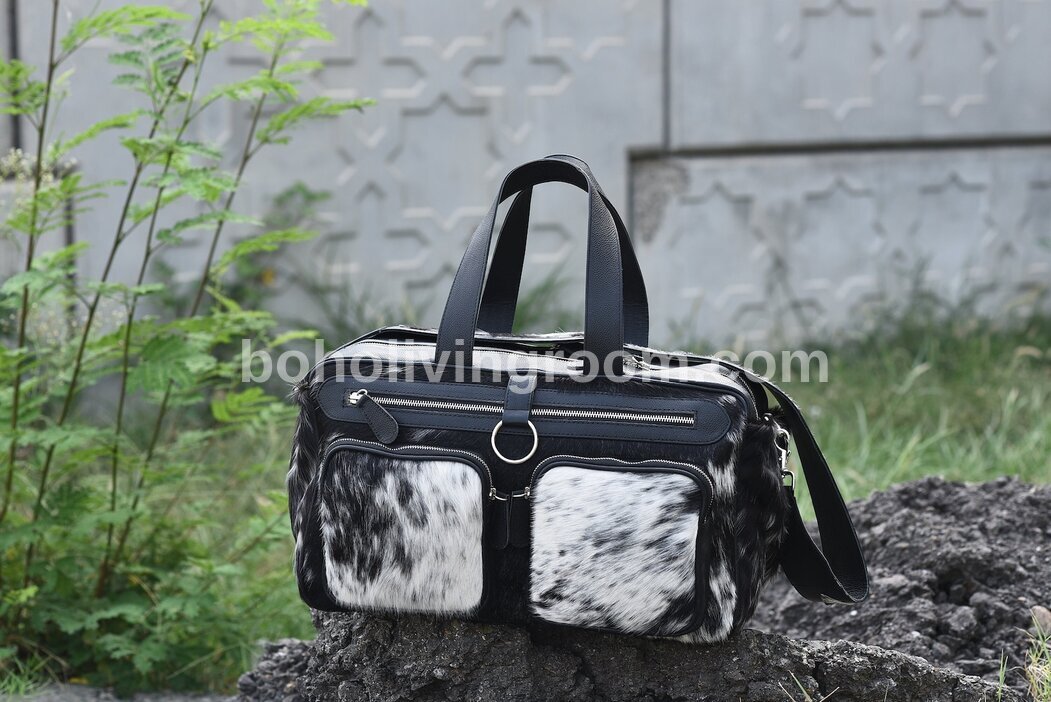 Pack smart with our reliable cowhide duffle bag. Crafted for durability and designed for convenience, it's the perfect travel solution.