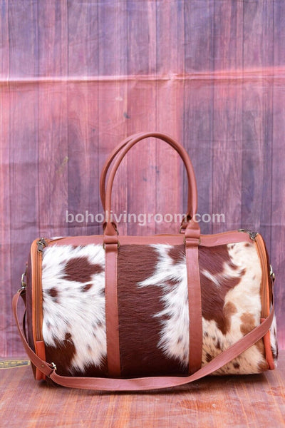 Cowhide travel bag handcrafted leather, built to roam. Weekends, gym, rodeo ready, southern style, timeless gift. 