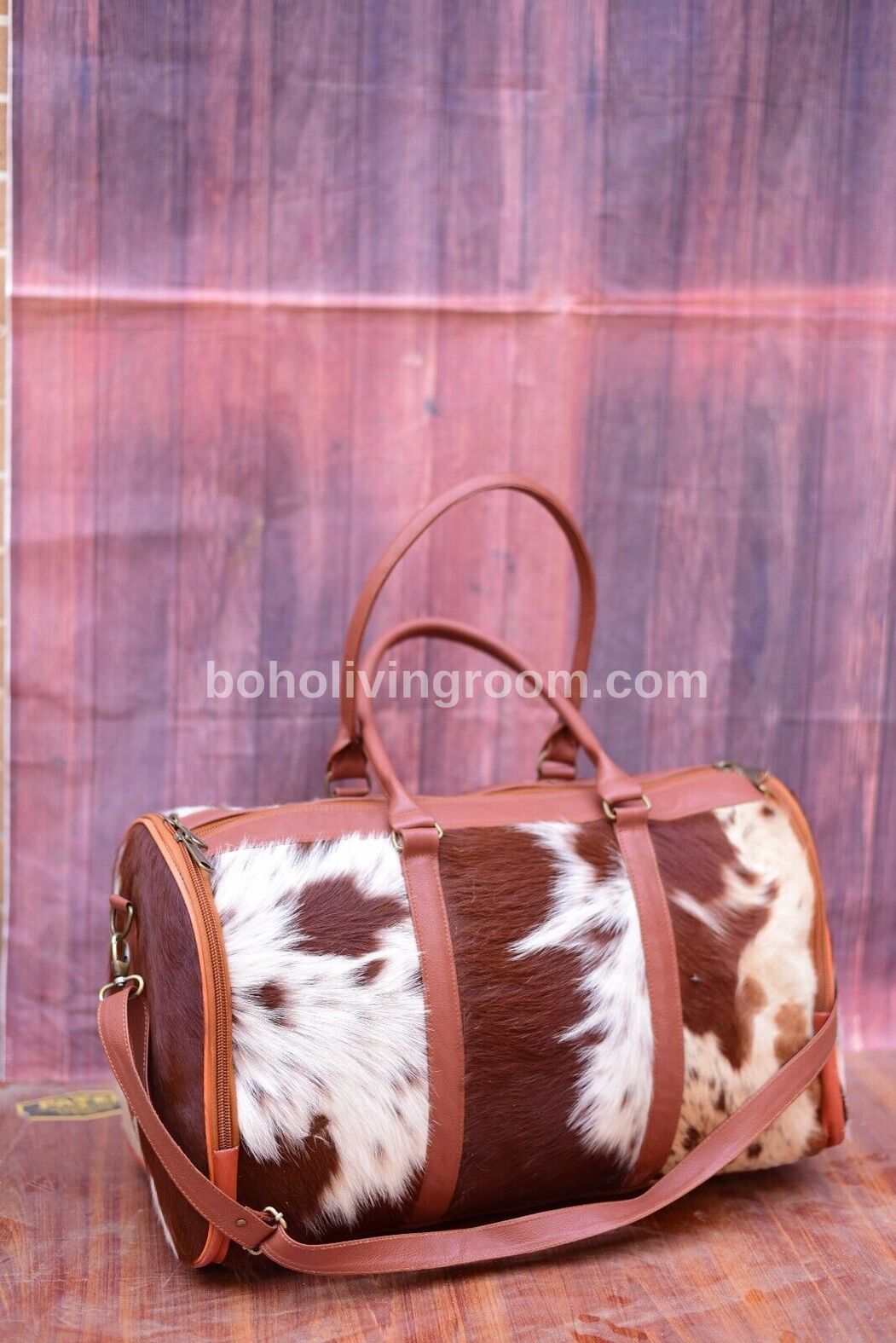 Rugged cowhide weekender bag long trips, gym, rodeo. Southwest flair. Built for miles & memories.