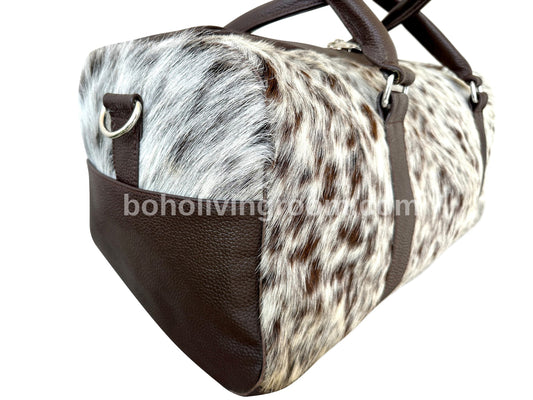 Make a statement with this cowhide overnight bag, your symbol of refined luxury.