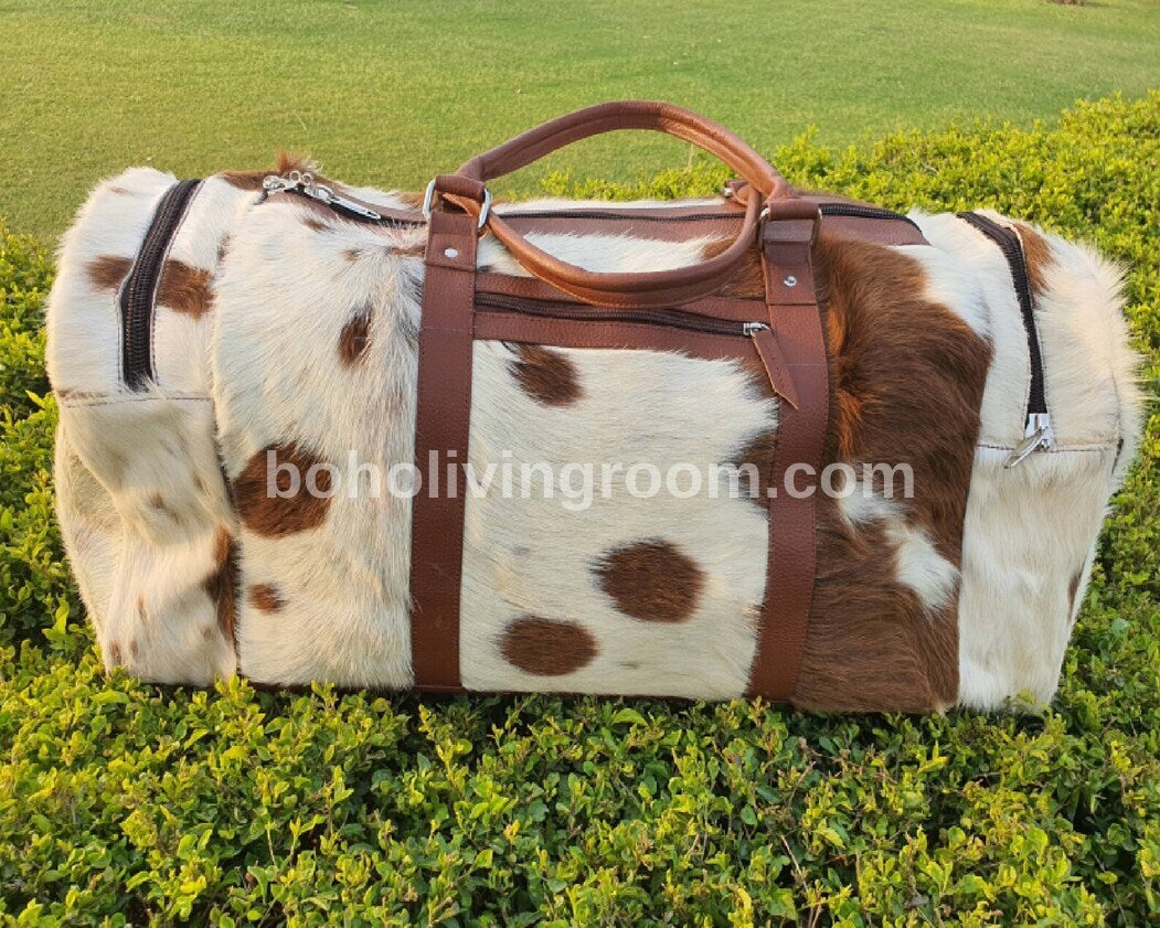 Make a statement with a timeless cow fur weekender bag, your essential companion for spontaneous getaways.