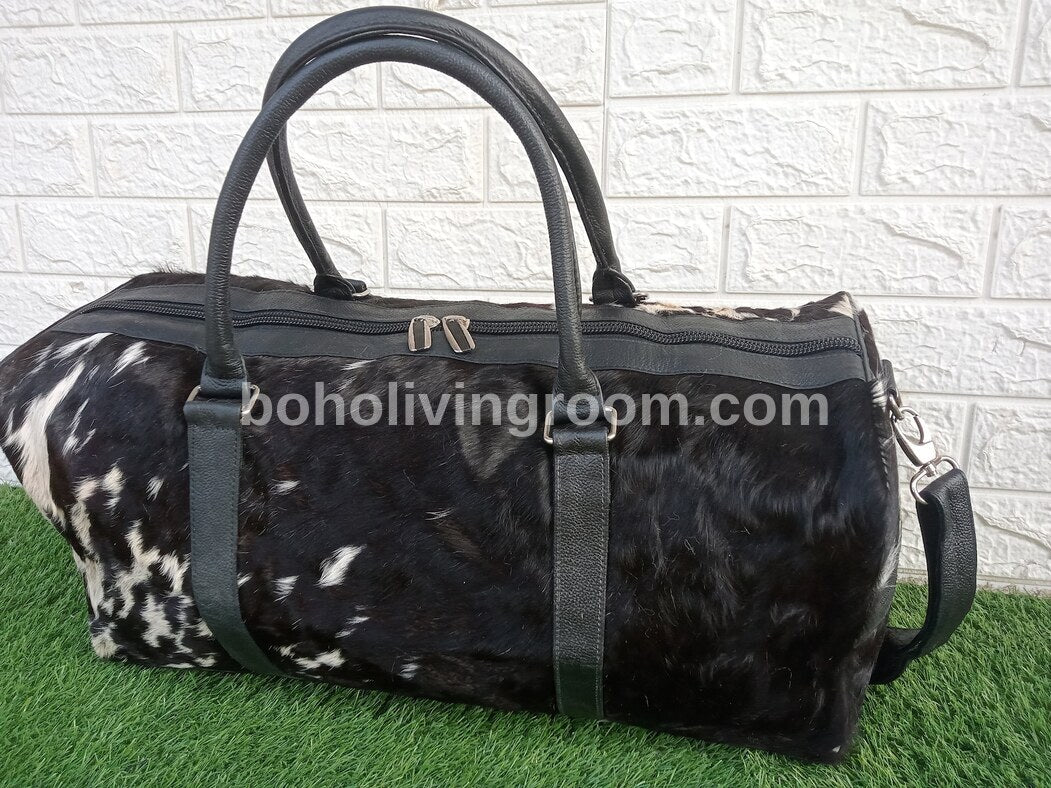 Experience luxury on-the-go with this cow skin weekender bag, your travel essential.