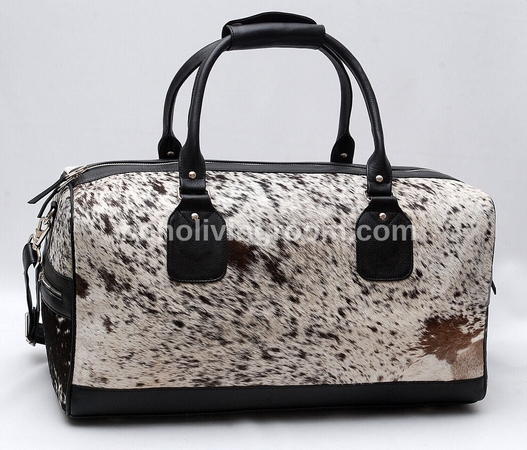 Embark on a journey of sophistication with this cow skin duffle bag, blending rugged charm with timeless luxury for the discerning traveler.
