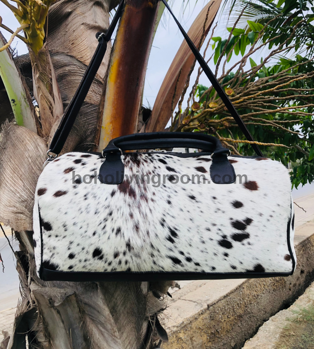 Step out in style with our rugged cowhide duffle bag. Crafted for durability and designed for adventure, it's your go-to travel companion.
