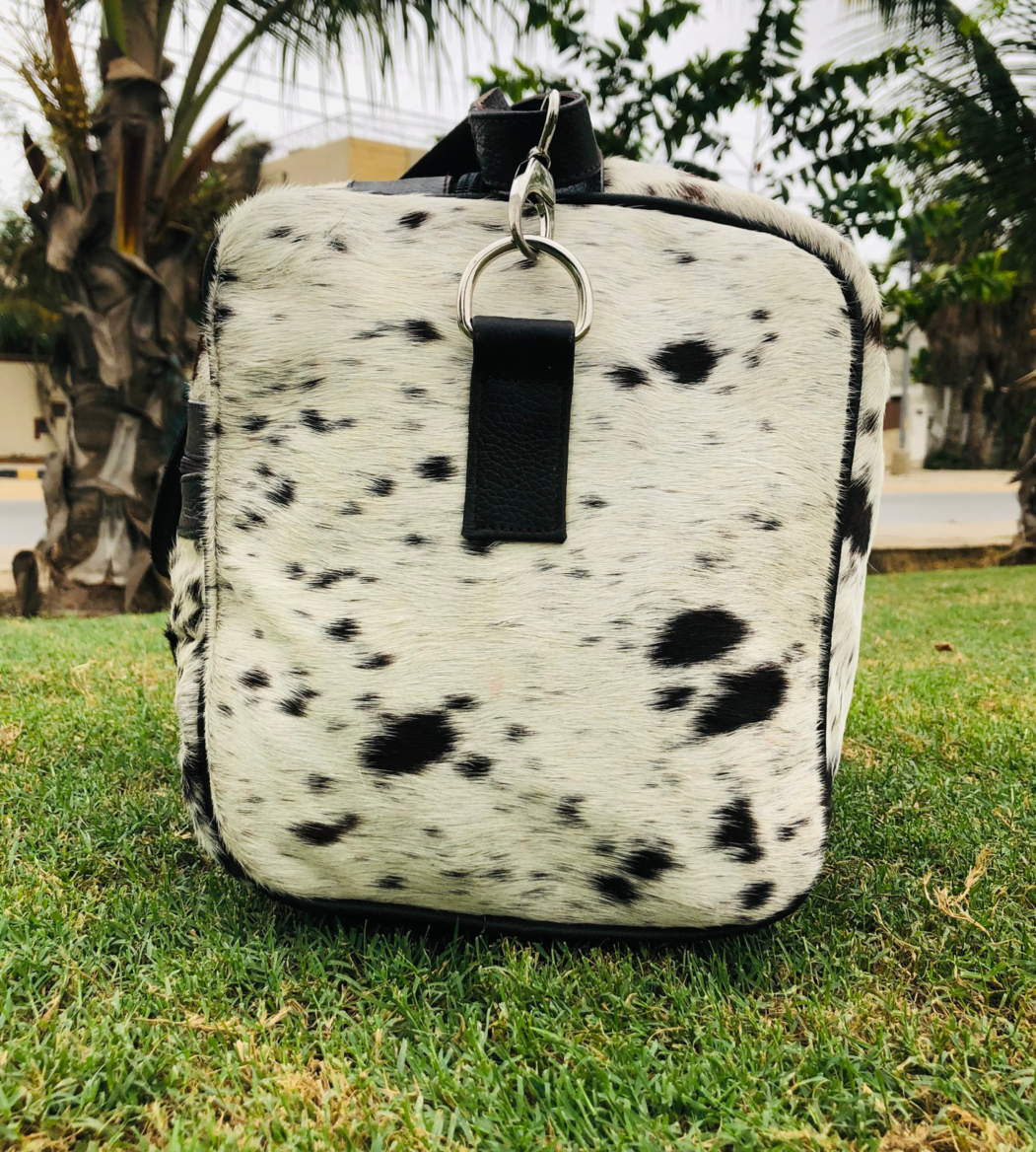 Elevate your travel game with our top-quality cowhide duffle bag. Spacious, sturdy, and stylish, it's the ultimate travel accessory.