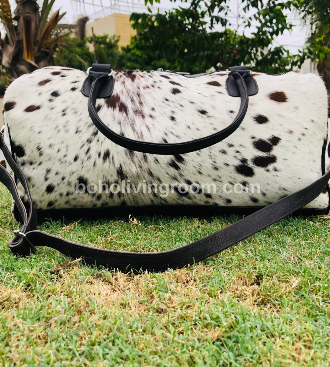 Get ready for your next getaway with our durable cowhide duffle bag. Roomy enough for all your essentials, it's the perfect travel companion.