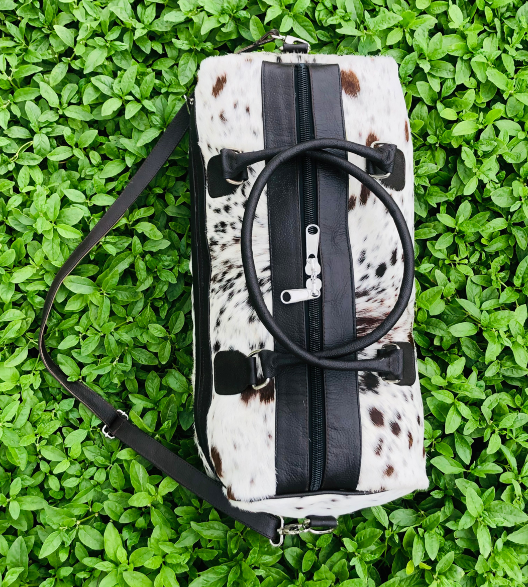 Take on any adventure with our reliable cowhide duffle bag. Designed for durability and comfort, it's the perfect travel solution.