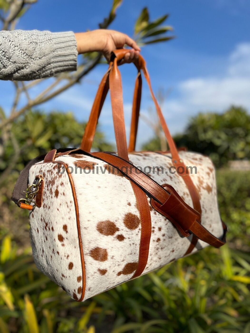 Experience elegance with a premium cow fur duffle bag, crafted to enhance your travel experiences.