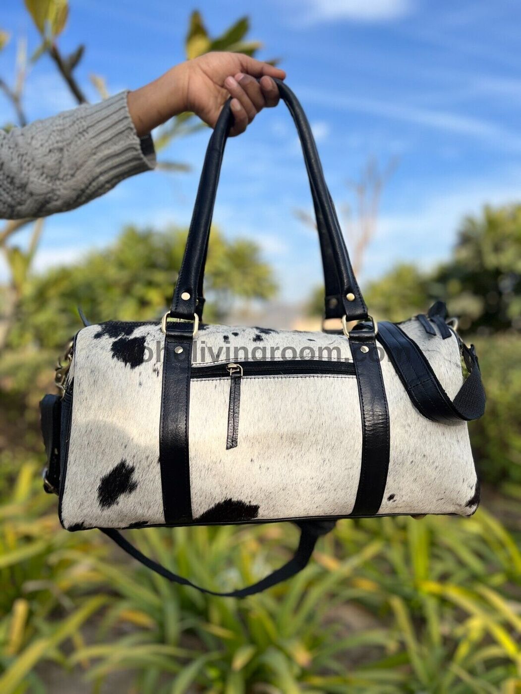 Define your journey with this cowhide duffle bag, a symbol of adventure and refined taste.