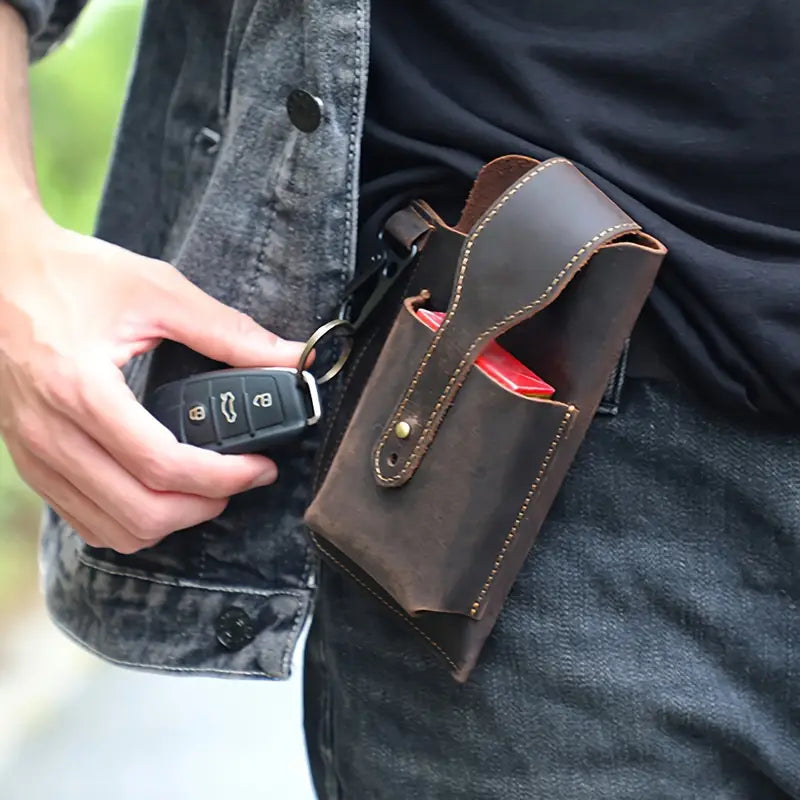 A functional leather pouch with a belt loop for easy access. Ideal for keeping your phone and other essentials secure while on the move.