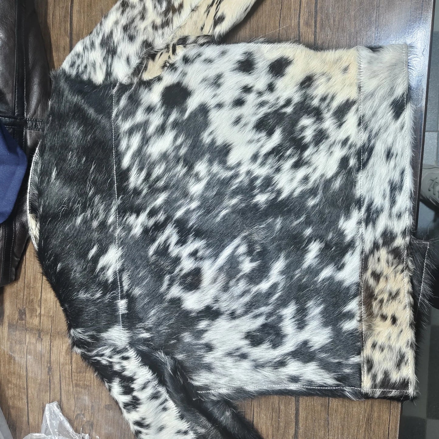 Discover the impact of natural cowhide in a cow print fur jacket for men and women. Each piece showcases unique patterns and premium texture.