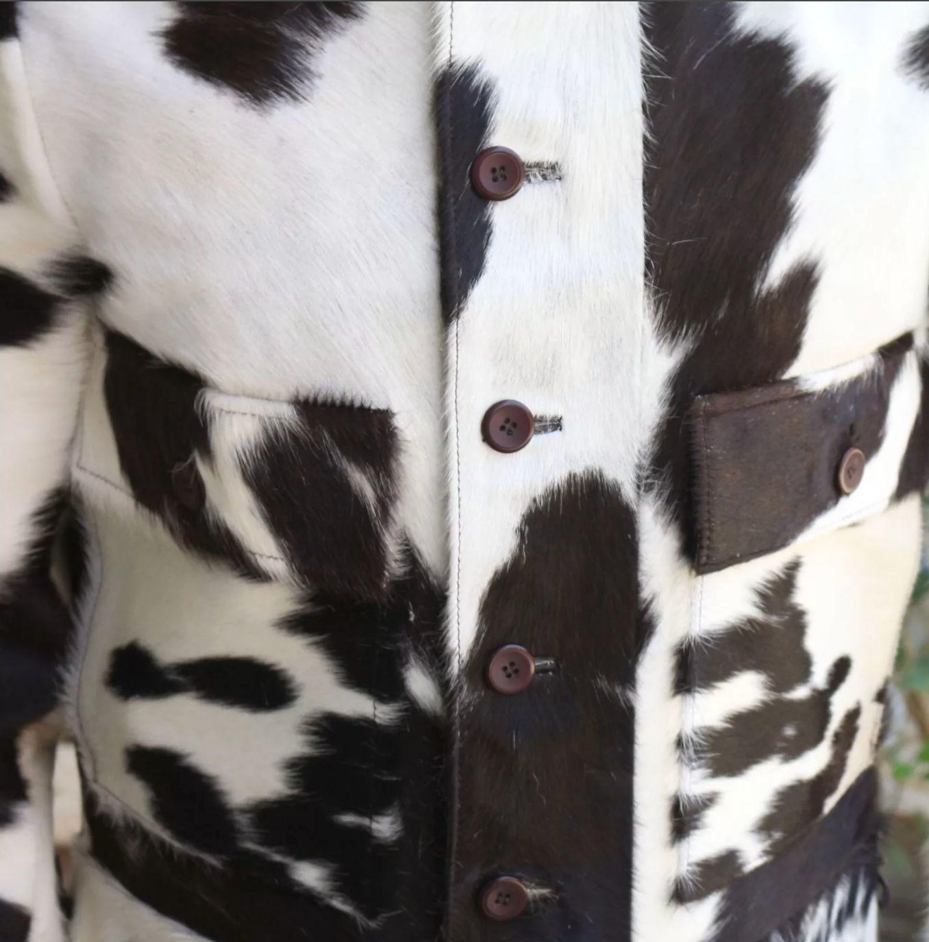 Cow print jacket mens style made with authentic cowhide leather. Classic button-up front and flap pockets for rugged, everyday outerwear appeal.