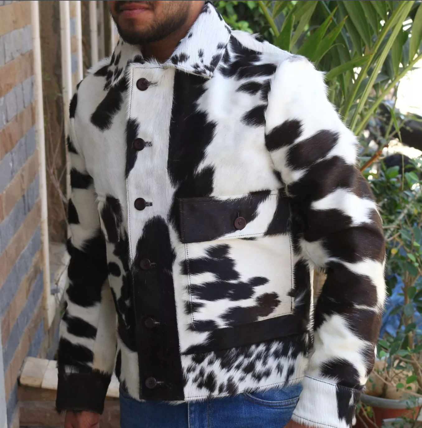 Mens cow print jacket made with high-quality cowhide and crafted in a bold spotted pattern. A jacket fit for streetwear, events, and layering.