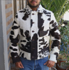 Men’s cowhide jacket made from real hair-on-hide leather in natural black and white cow print. Unique cowhide coat designed for fall, winter, or rodeo wear.