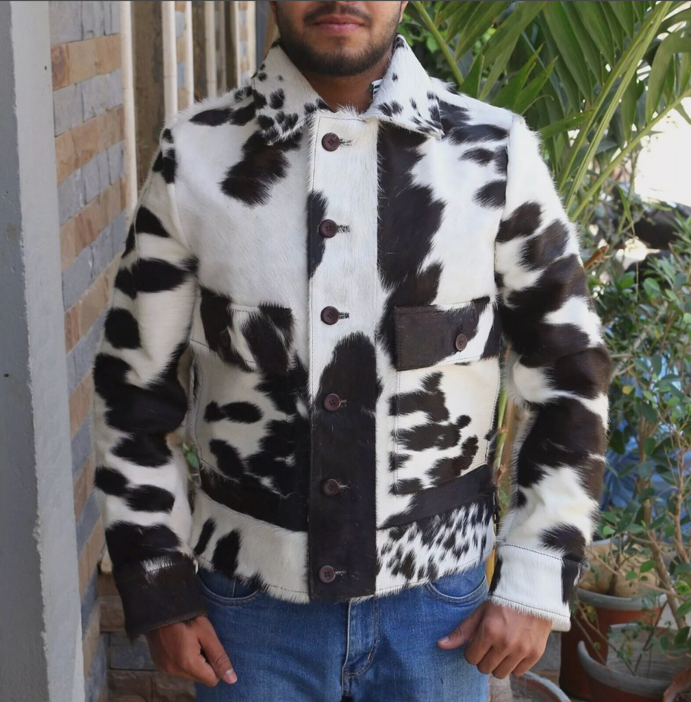 Men’s cowhide jacket made from real hair-on-hide leather in natural black and white cow print. Unique cowhide coat designed for fall, winter, or rodeo wear.