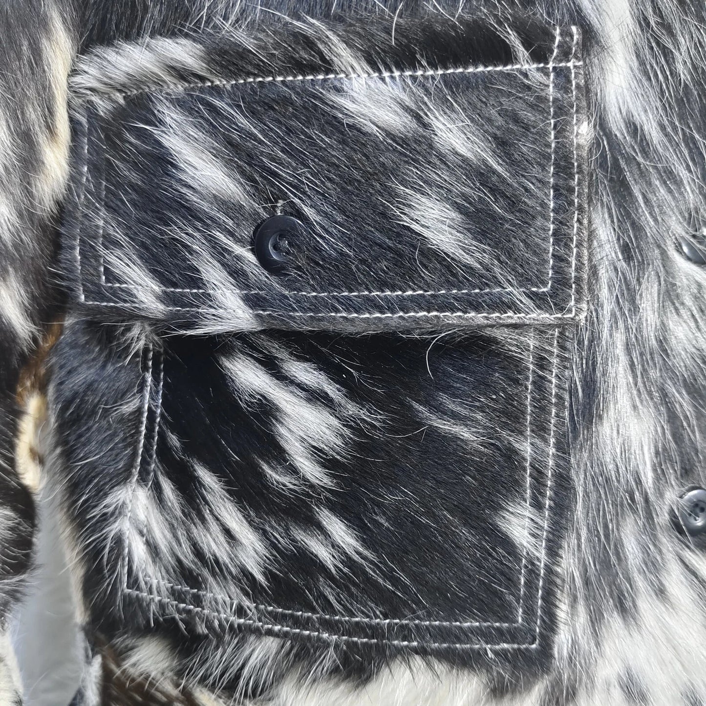 Get noticed in a cow print fur jacket made from 100% real cowhide. A unique, bold outerwear option for fashion enthusiasts and collectors.