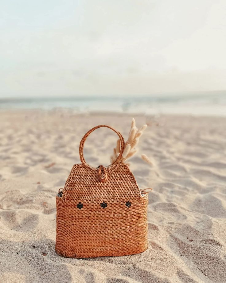 Rattan bags displayed at a tropical market stall.