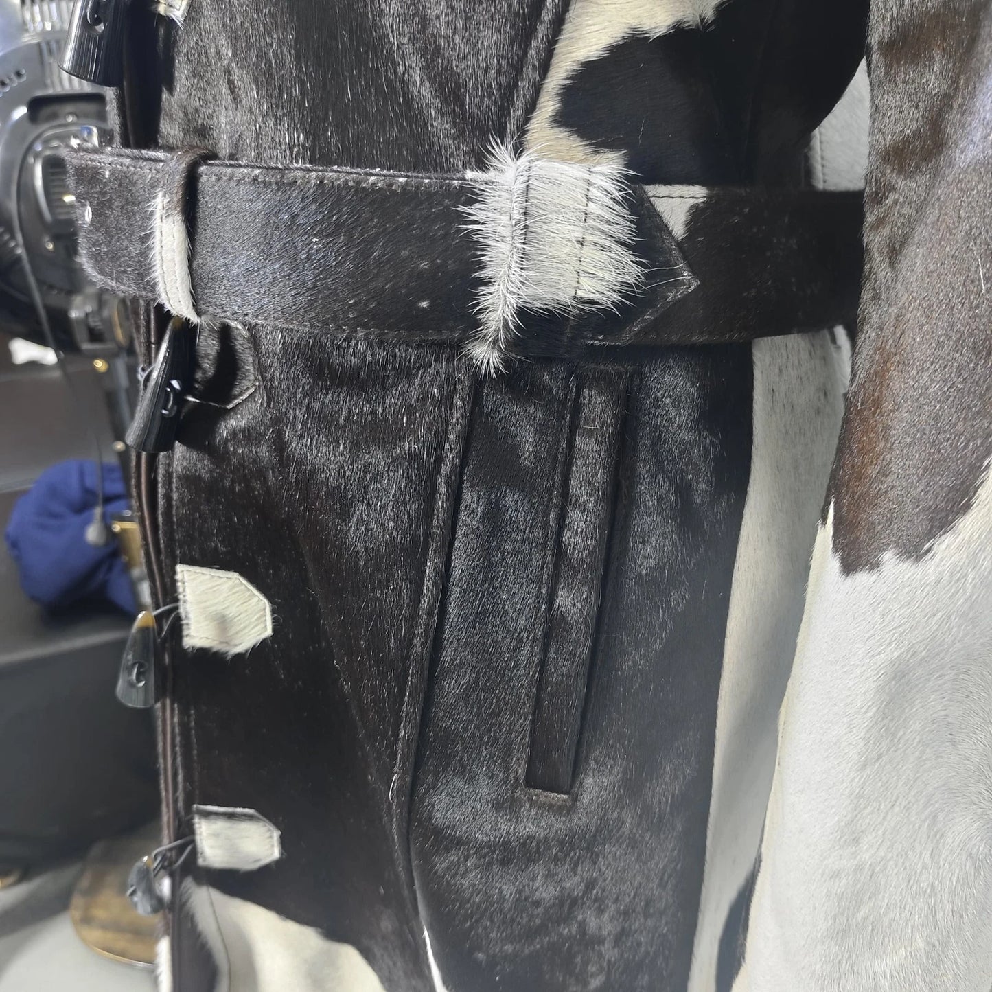 This cow print trench coat brings rustic style to modern fashion with real cowhide leather and a tailored, full-length silhouette.