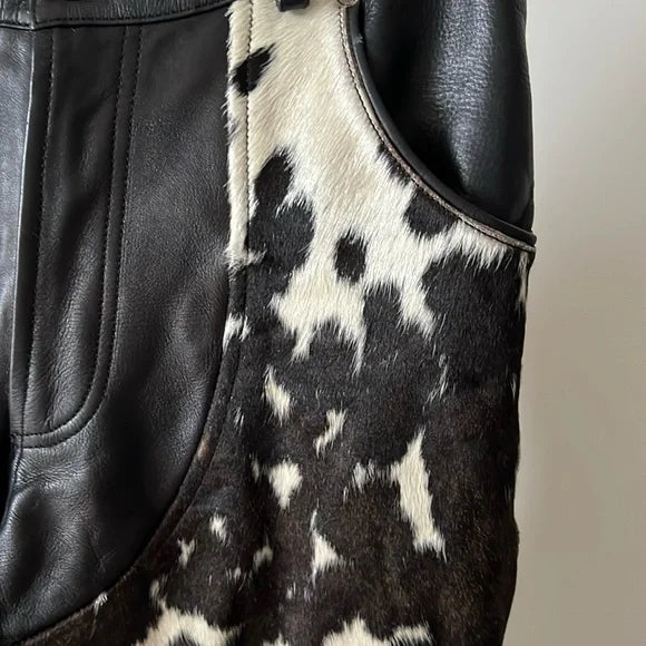 A mix of cowhide fur and leather shapes these trousers into a bold statement piece. Rich textures bring a distinct touch to those who appreciate standout designs.