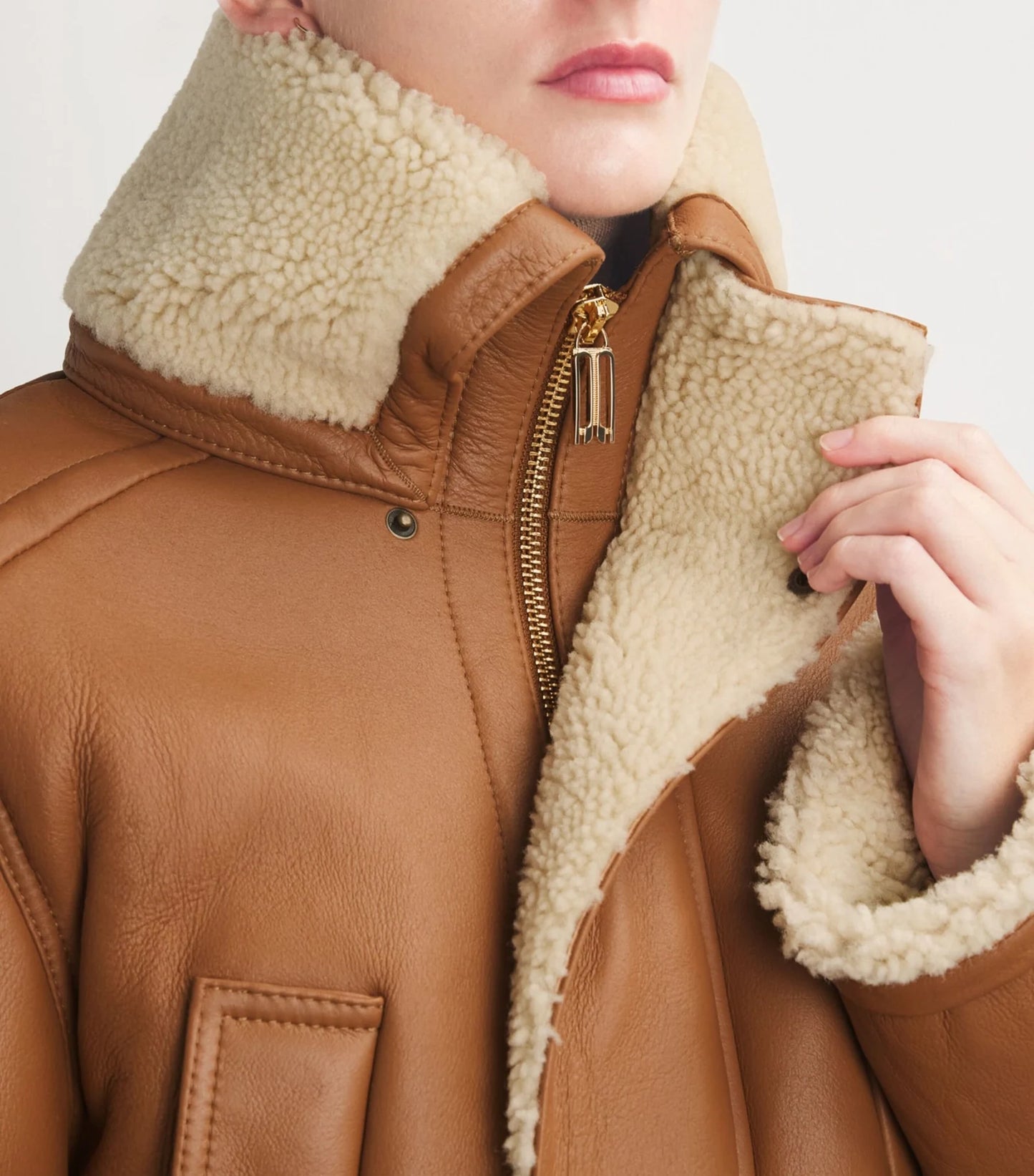 Classic genuine leather coat displayed on a mannequin, highlighting premium quality and timeless design.