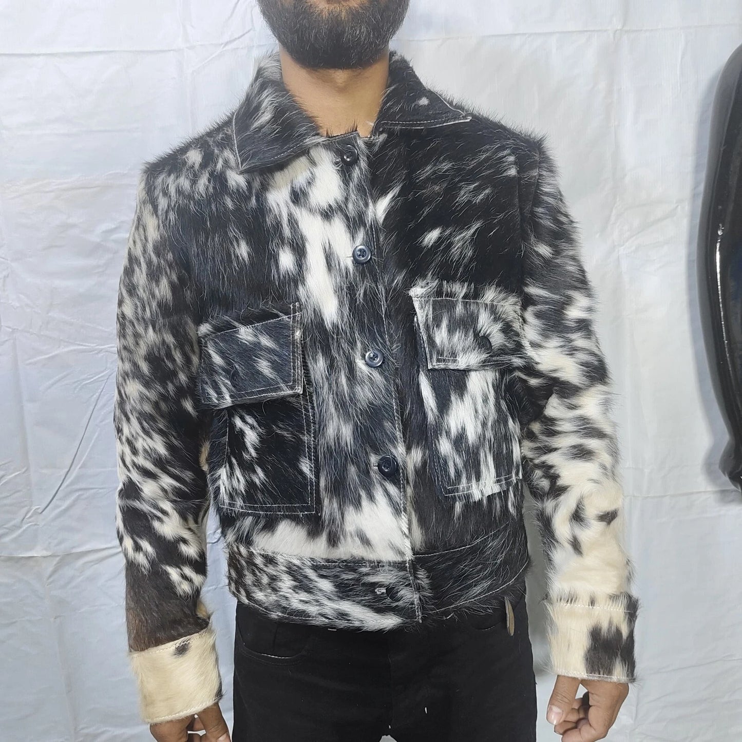 Elevate your outerwear game with a striking cow fur jacket made from natural hides, offering unmatched style and texture.