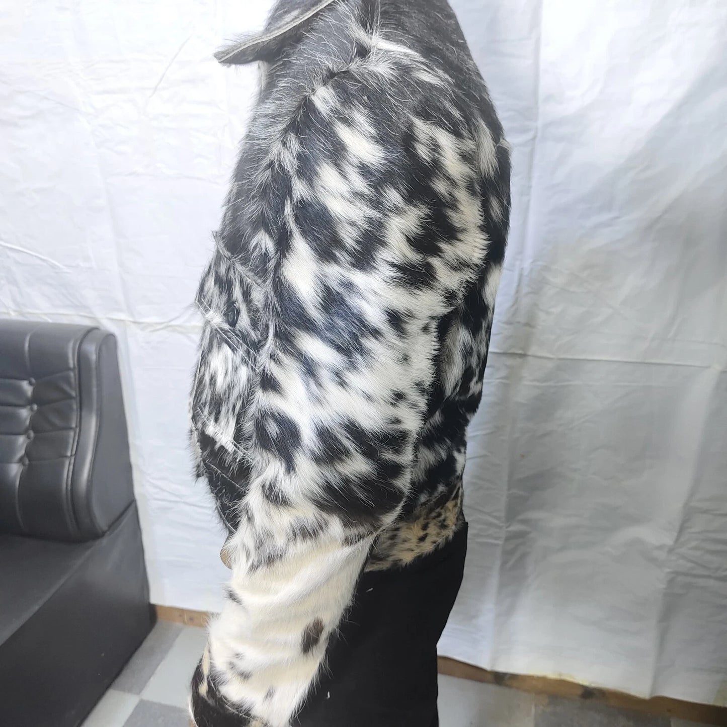 This speckled cow fur jacket blends rustic charm with modern fashion, crafted from real cowhide for a one-of-a-kind look.