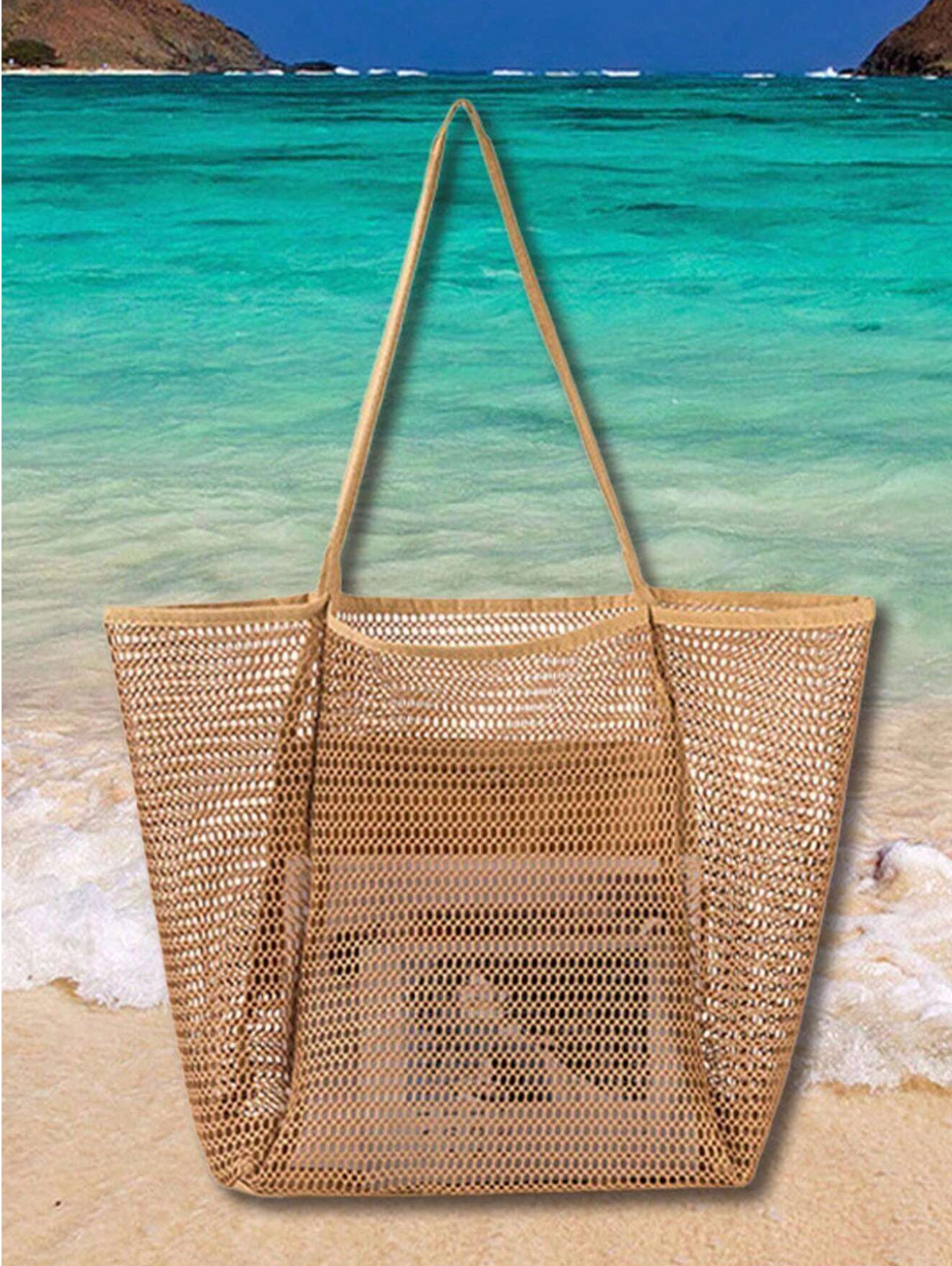 Neutral-toned straw bag beside a sunhat and lemonade on a patio table