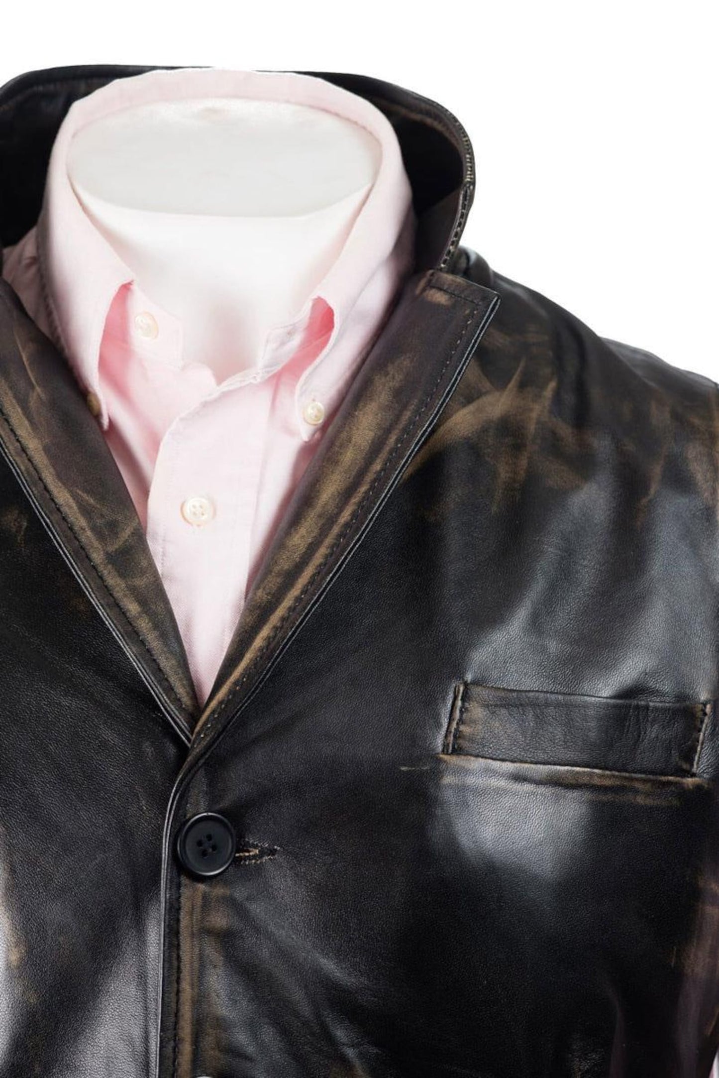A trendy men’s leather vest with zippered pockets, worn over a plain black T-shirt for a modern look.